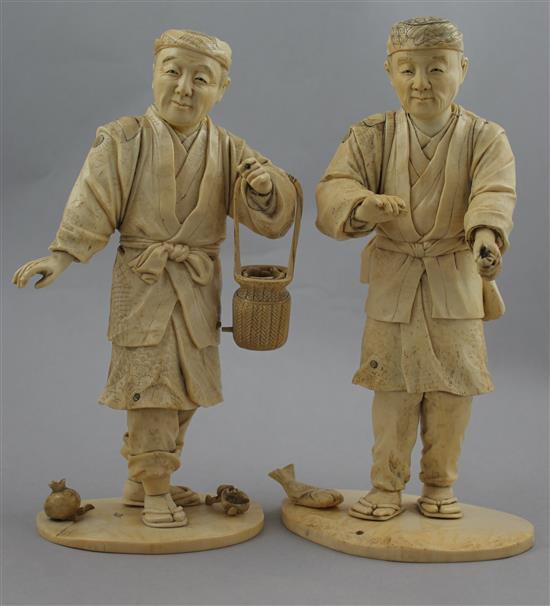 A pair of Japanese bone and ivory sectional figures of fruit pickers, early 20th century, 21cm and 22cm, losses